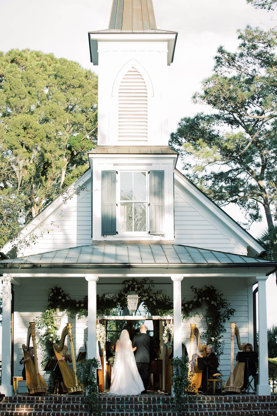 Kiral Artists harp player performing during a wedding ceremony at Palmetto Bluff in South Carolina